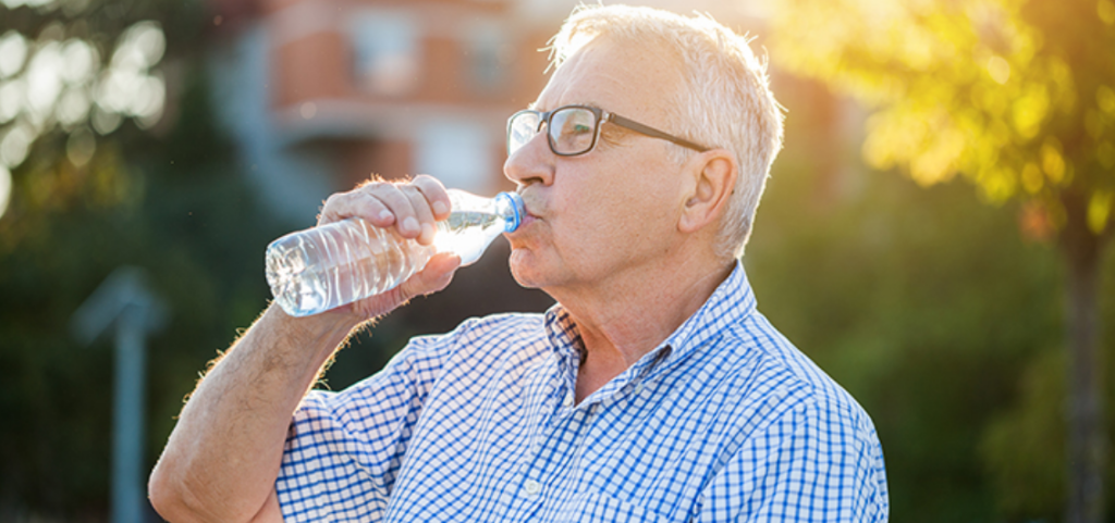 senior man drinking water