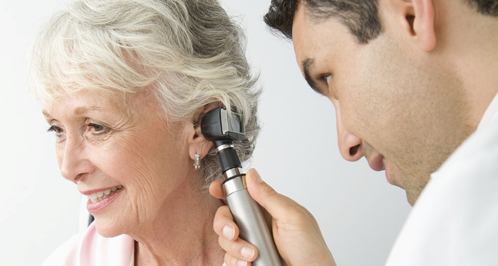 ear doctor examining patient